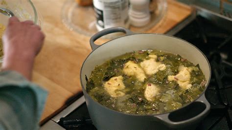 stewed-greens-with-cornmeal-dumplings image
