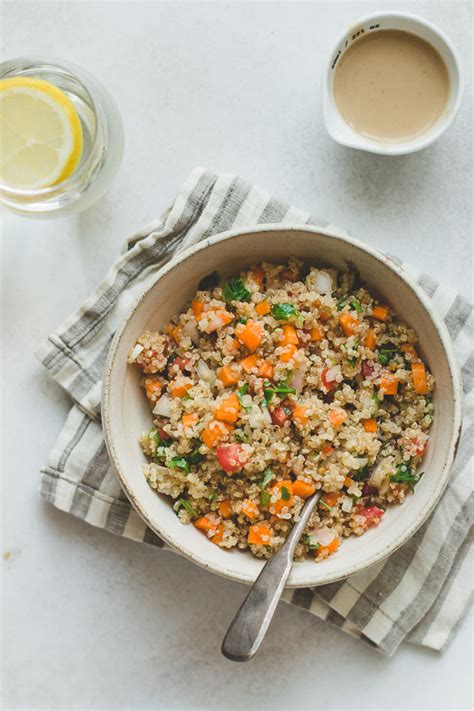quinoa-salad-with-vegetables-and-tahini-dressing image