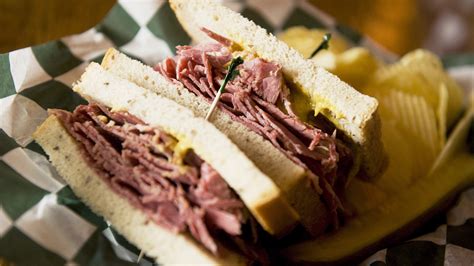 corned-beef-sandwiches-with-irish-cheddar-and-pickles image