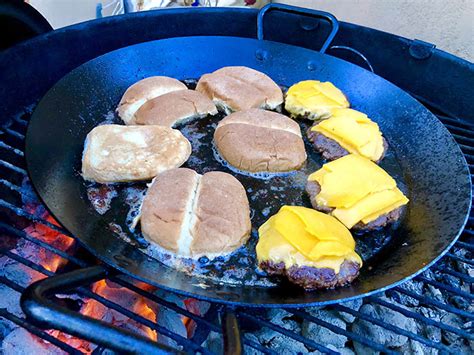 use-your-paella-pan-to-grill-smashed-cheeseburgers image