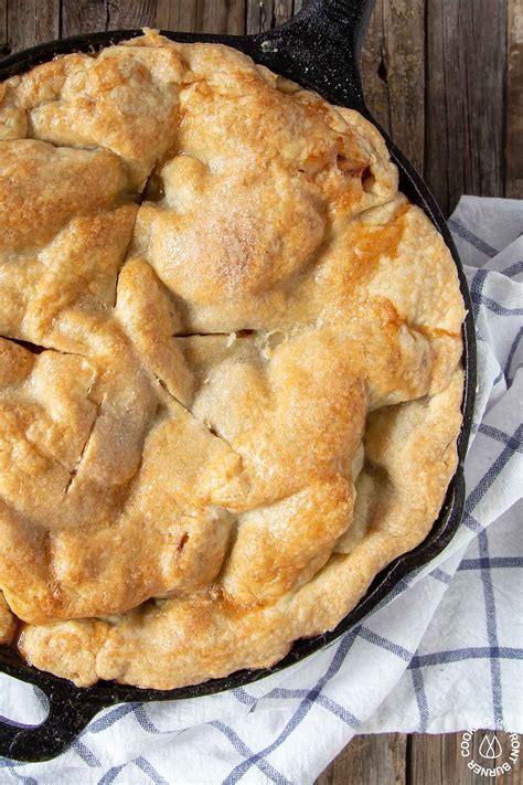 cast-iron-skillet-apple-pie-cooking-on-the-front-burner image