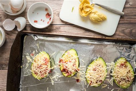 baked-avocado-eggs-with-bacon-and-cheese image
