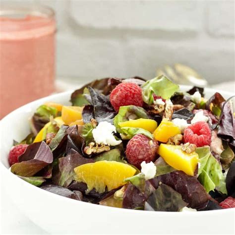 peaches-and-greens-salad-with-raspberry-vinaigrette image