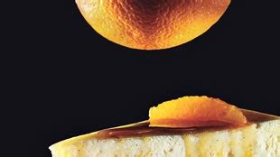 ricotta-cheesecake-with-caramel-orange-sauce image