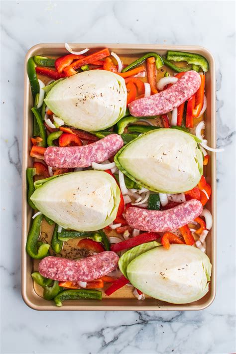 sheet-pan-beer-braised-brats-and-cabbage-girl image