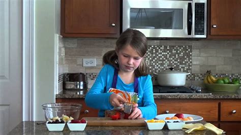 kids-kitchen-how-to-make-a-simple-fruit-salad image