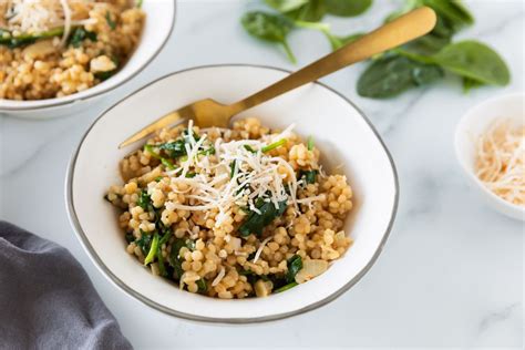 israeli-couscous-risotto-with-spinach-and-parmesan-cheese image
