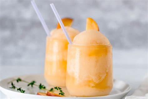 frozen-peach-bellini-cocktail-recipe-eatwell101 image