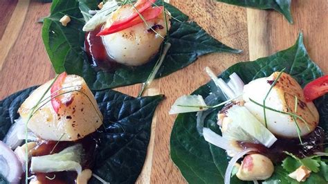 betel-leaf-with-seared-scallops-lime-and-sticky-tamarind image