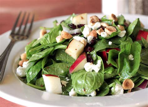 spinach-salad-with-bosc-pears-cranberries-red-onion image