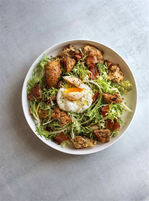 frise-salad-with-bacon-croutons-and-poached-egg-lyonnaise image