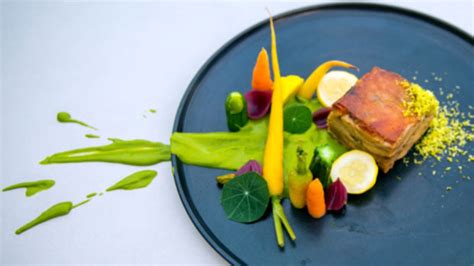 lechon-with-pistachio-mole-and-pickled-vegetables image