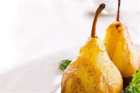 flambeed-vanilla-poached-pears-with-apricot-sauce image