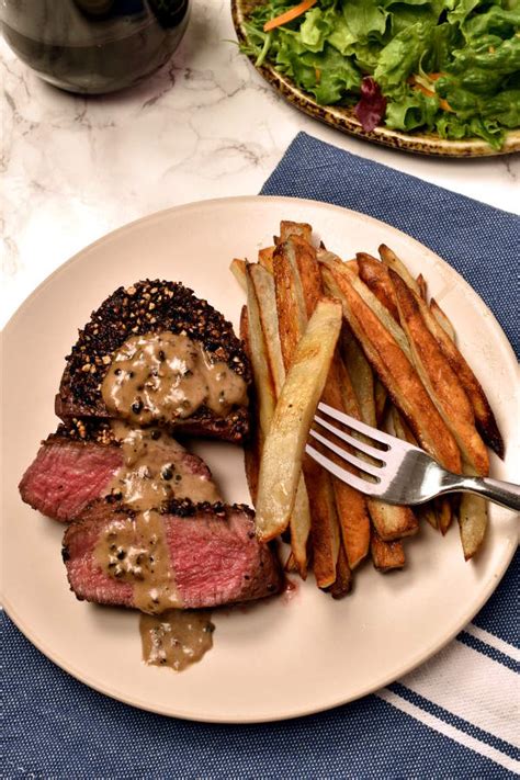 steak-au-poivre-peppercorn-crusted-with-oven-fries image