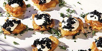 potato-blini-with-sour-cream-and-caviar image