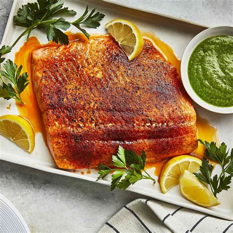 baked-salmon-with-lemon-shallot-herb-sauce-eatingwell image