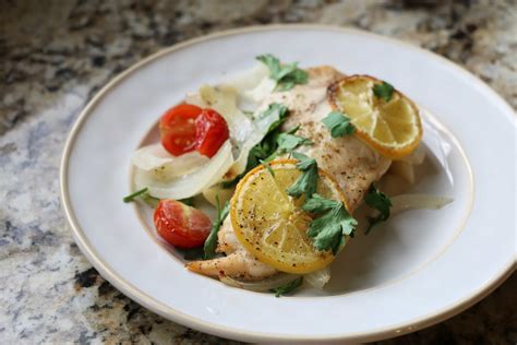 baked-tilapia-recipe-with-tomato-and-onions image