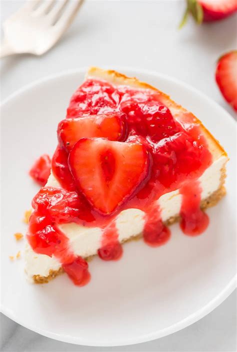 greek-yogurt-cheesecake-with-fresh-strawberry-sauce image