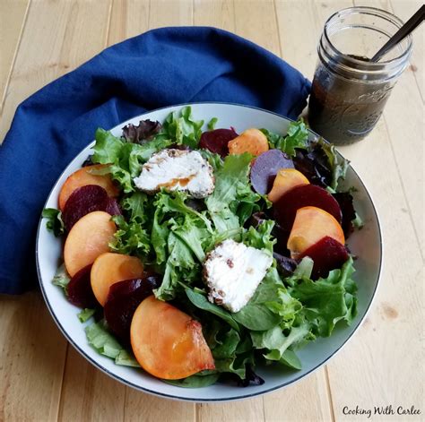 persimmon-and-beet-salad-with-pecan-crusted-goat-cheese image