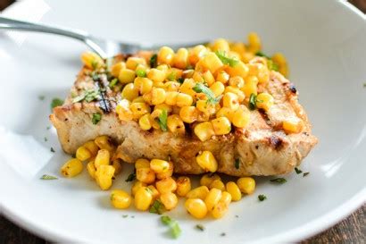 grilled-buttermilk-boneless-pork-chops-with-spicy-corn image