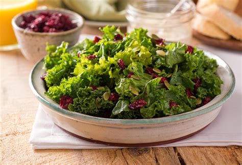 massaged-kale-salad-with-pepitas-cranberries image