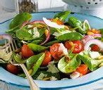 spinach-salad-with-warm-lemon-and-garlic-dressing image