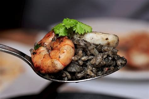 squid-ink-risotto-with-prawns-recipe-uncut image
