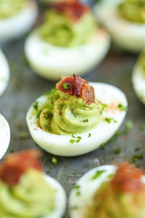 avocado-deviled-eggs-damn-delicious image