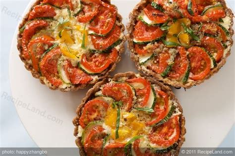 cheesy-tomato-and-zucchini-mini-tarts image