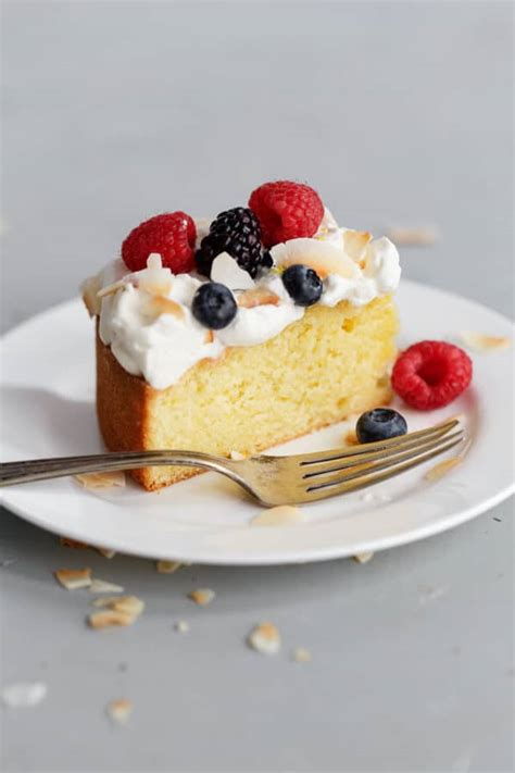 lemon-coconut-cake-with-cream-and-berries-a image