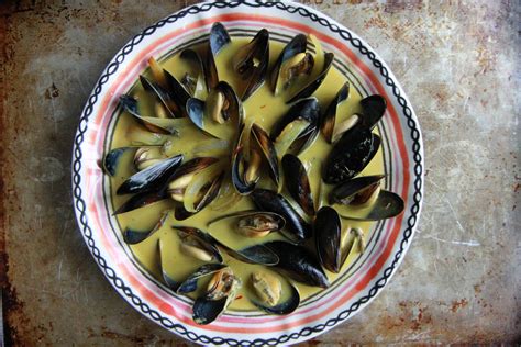 mussels-in-saffron-coconut-broth-heather-christo image