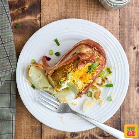 loaded-baked-potatoes-wrapped-in-bacon-sunday image