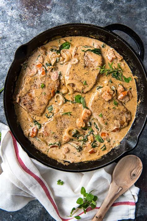tuscan-smothered-pork-chops-the-crumby-kitchen image
