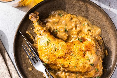 smothered-chicken-recipe-with-creamy-onion-gravy image