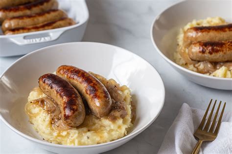 bangers-and-mash-with-onion-gravy-recipe-the-spruce image
