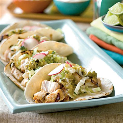 fish-tacos-with-jicama-cilantro-coleslaw-recipe-myrecipes image
