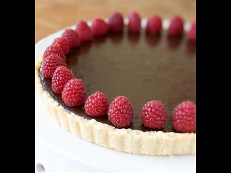 bittersweet-chocolate-tart-with-raspberries-whole image