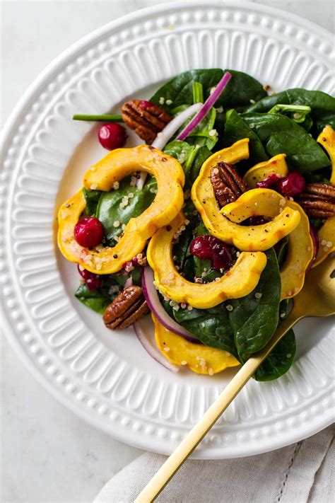 roasted-delicata-squash-salad-with-cranberries-healthy image