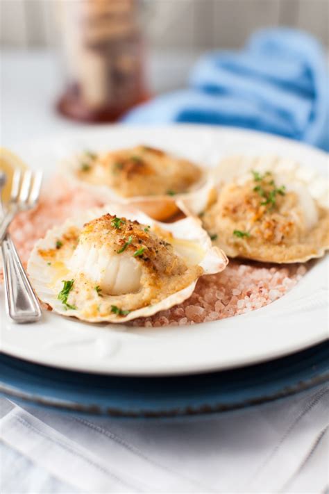 baked-scallops-with-cheese-and-wine-sauce-cooking image