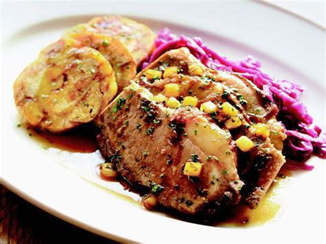 beef-sauerbraten-with-red-cabbage-and-pretzel image