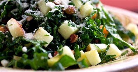 kale-salad-with-apples-cheddar-and-toasted-almonds image
