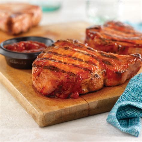 grilled-ribeye-rib-pork-chops-with-easy-spicy-bbq image