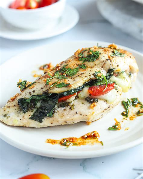 cheesy-pesto-spinach-stuffed-chicken-breasts-low image