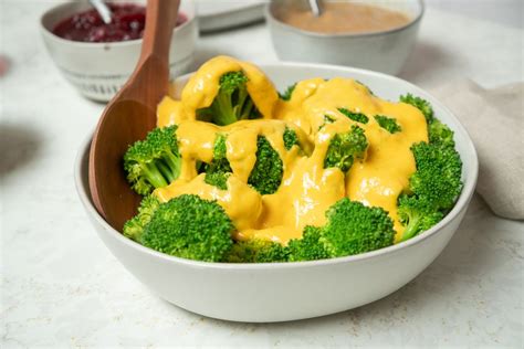 easy-broccoli-with-cheese-sauce-recipe-the-spruce image