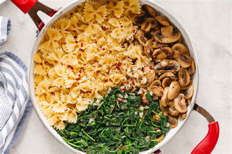 parmesan-spinach-mushroom-pasta-skillet-recipe-eatwell101 image