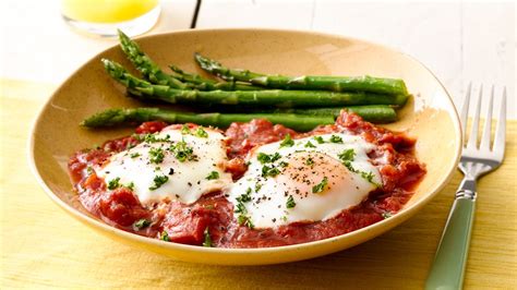 poached-eggs-with-tomato-sauce-and-asparagus image
