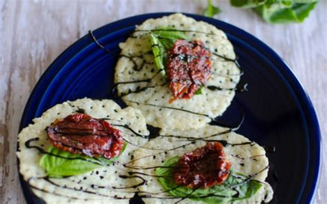 parmesan-crisps-with-basil-and-sun-dried-tomato image