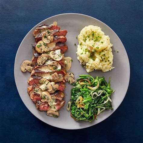 ny-strip-steaks-herb-mushroom-pan-sauce-blue image