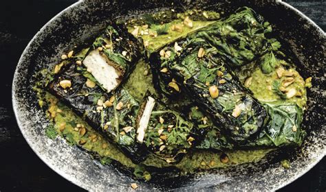 vegan-jerk-tofu-wrapped-in-collard-leaves-vegnews image