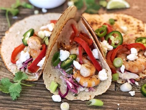 spicy-diablo-shrimp-tacos-with-simple-slaw-and-feta image